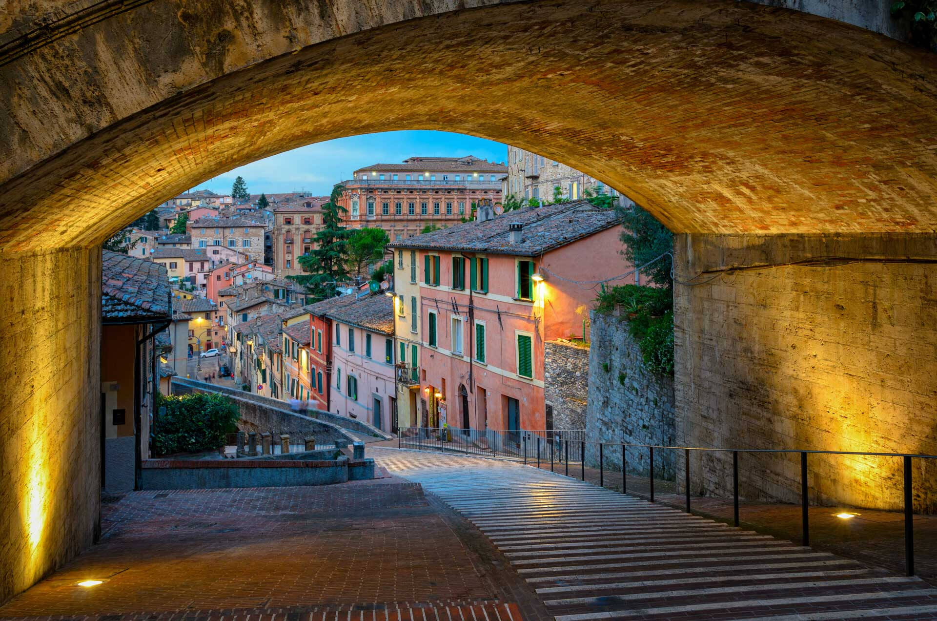A Tunnel overlooking other buildings at dusk in Perugia, Italy
